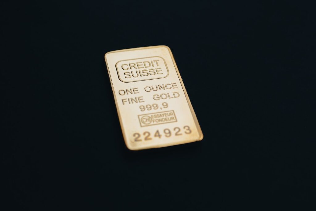 a gold bar sitting on top of a black surface