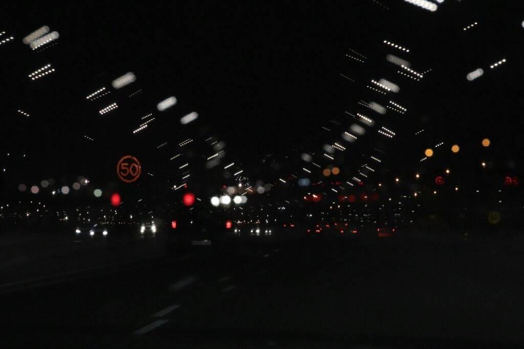 a blurry photo of a city street at night