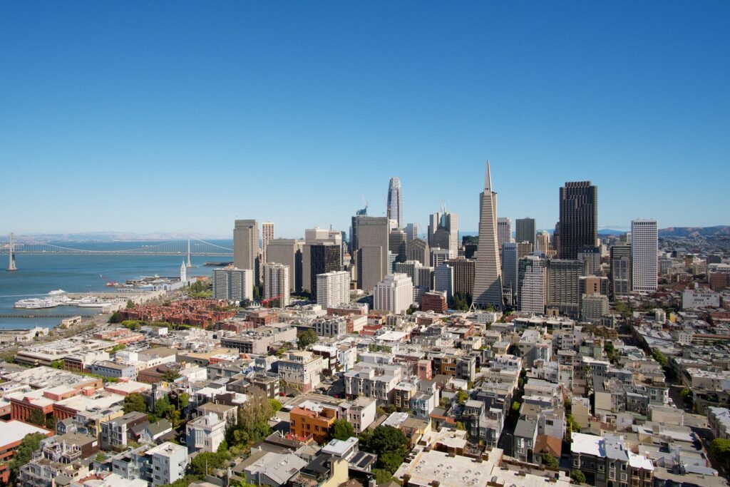 city buildings under blue sky during daytime