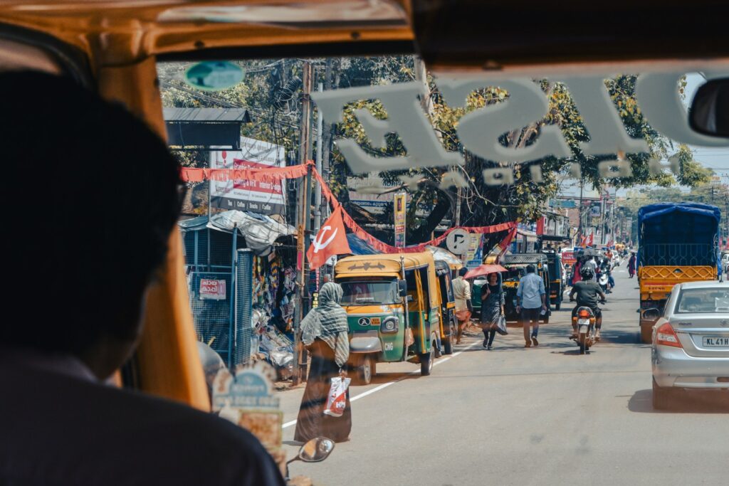 a view of a busy street from inside a vehicle