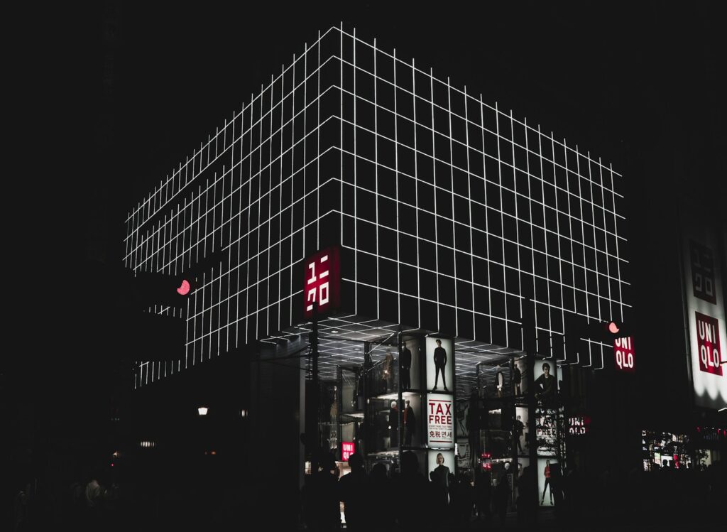 UNIQLO building with billboards at night