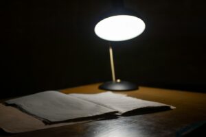 black table lamp beside book